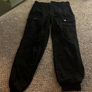 Black cargos with rips